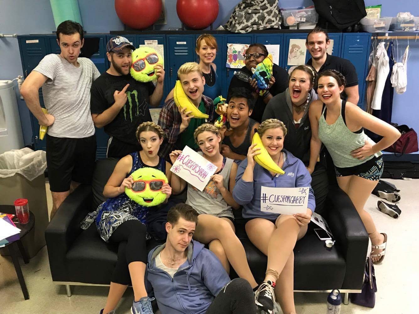 Cast of Fest Haus at Busch Gardens Williamsburg with #CuesForGabby sign